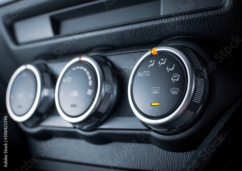 Air conditioner button for adjusting the wind direction in a luxury car