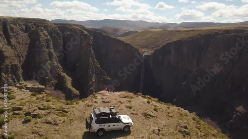 Aerial view of jeep and travellers at viewpoint near Maletsunyane Falls in Lesotho photo