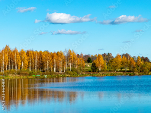 colorful autumn landscape by the lake, golden autumn, colorful trees and reflections
