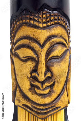 close-up vertical view wooden face of buddha on white background