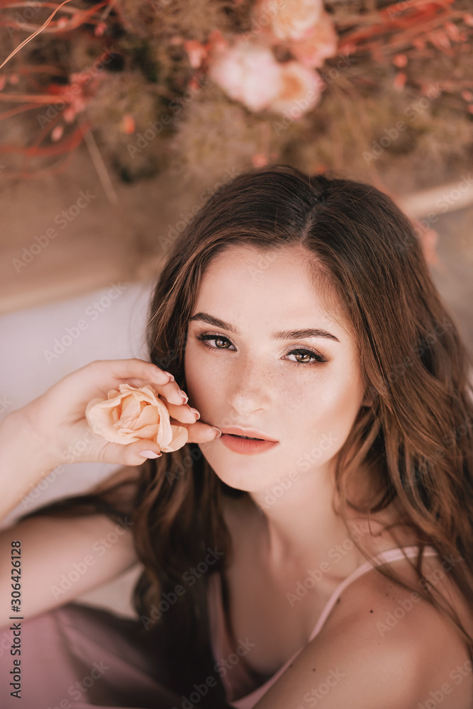 Naklejka premium Portrait of beautiful girl with flowers