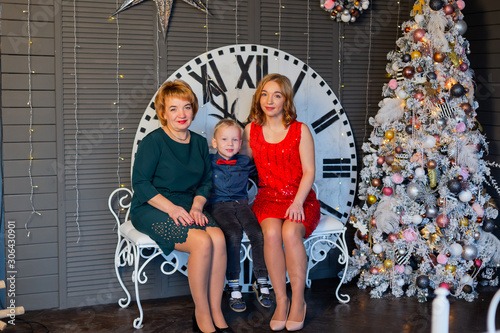 Happy mom grandmother and baby in New Year's decor. New Year 2020.