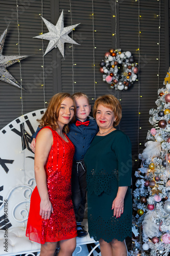 Happy mom grandmother and baby in New Year's decor. New Year 2020.