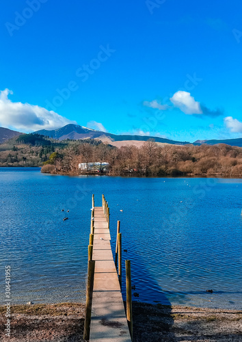 Print op canvas Wooden pier in Keswick town in the Lake District surrounded by mountains like Skiddaw and Derwentwater lake on a peaceful sunny day
