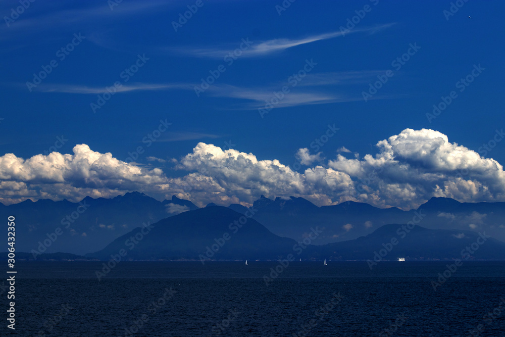 Shades of blue dotted by the clouds on the Pacific Ocean, BC, Canada