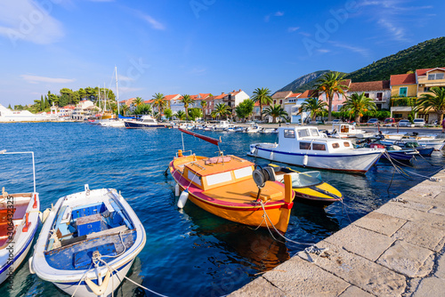 Fototapeta Naklejka Na Ścianę i Meble -  Colorful fishing boats in the Harbor of Trpanj town, Peljesac Peninsula, Dalmatia region, Croatia. The picturesque coast of the Adriatic sea in Trpanj town
