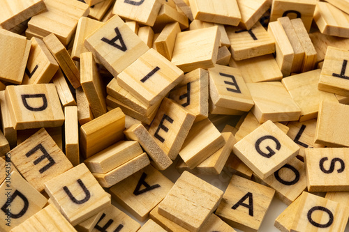 Heap of scrabble tile letters from above	 photo