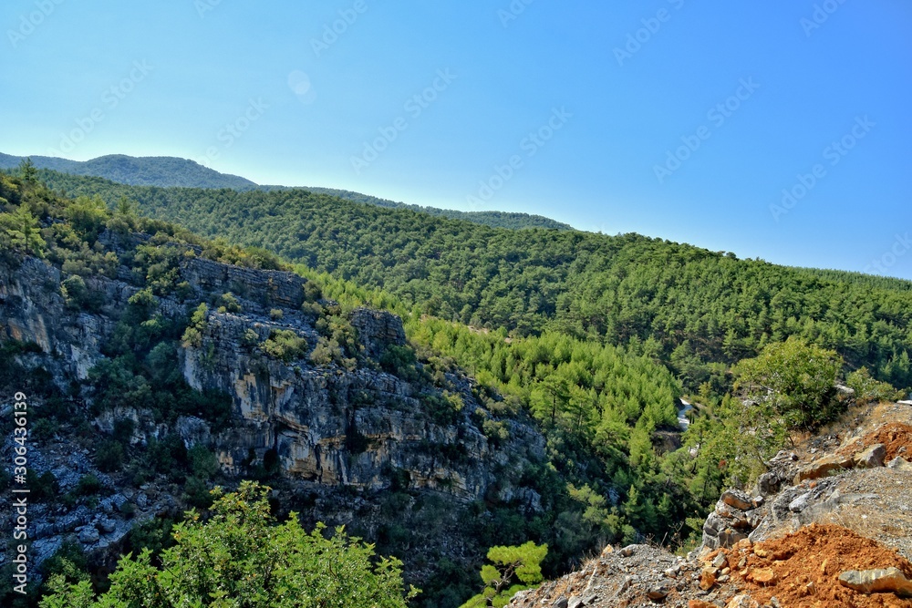 beautiful view of the Turkish mountains covered with green forest on a summer day,