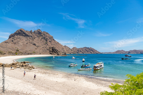 PADAR ISLAND   INDONESIA - NOVEMBER 4  2019  Landscape view at Padar island bay with tourists boats in Komodo islands  Flores.