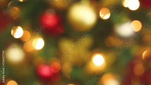 Close up looping stop motion animation of Christmas lights blinking on Christmas tree 