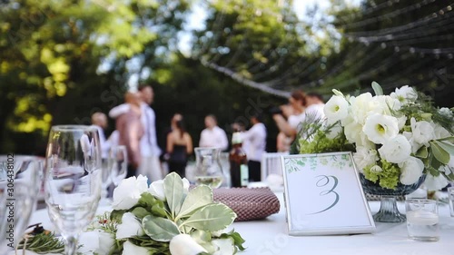 Elegant wedding banquet table with at the restaurant’s summer terrace