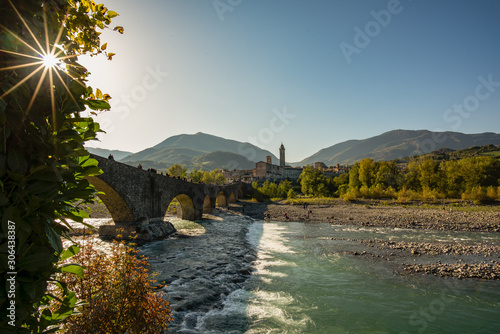 Città di Bobbio con ponte vecchio e fiume Trebbia photo