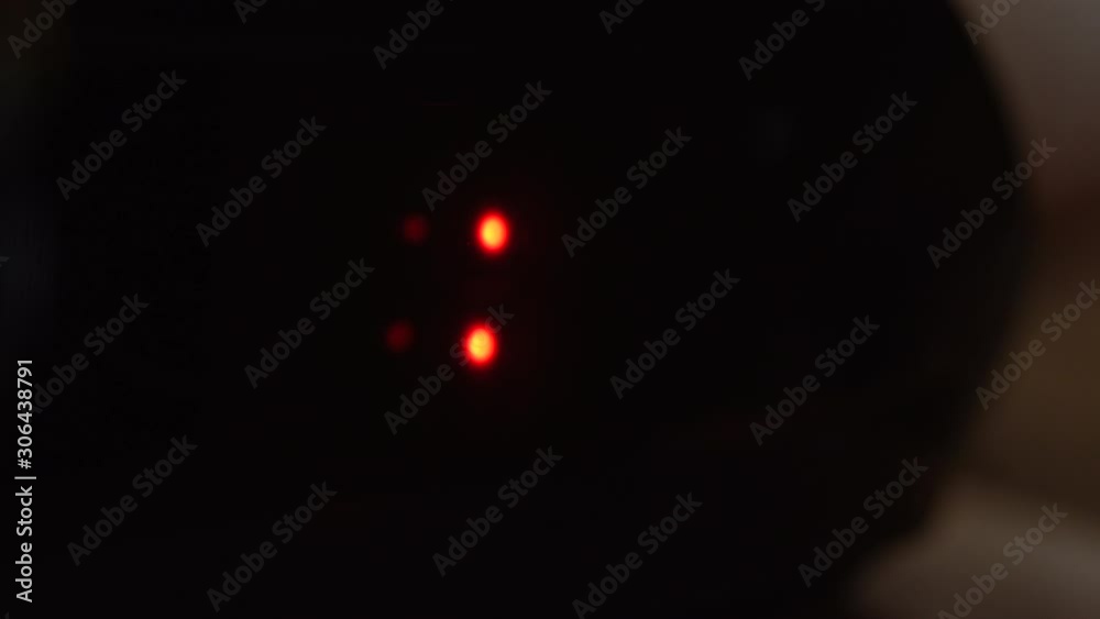 Close-up of black digital clock screen showing 18.00. Blinking red digital numbers on black background. Modern timer system and neon light, electric alarm device Close-up of black digital clock screen showing 18.00. Blinking red digital numbers on black background. Modern timer system and neon light, electric alarm device