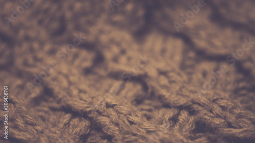 Knitted texture closeup, brown thread pattern, cozy winter background.