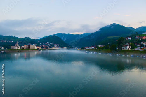 The Mehmed Pasa Sokolovic Bridge and Drina river in the evening fog. Visegrad. Bosnia and Herzegovina.