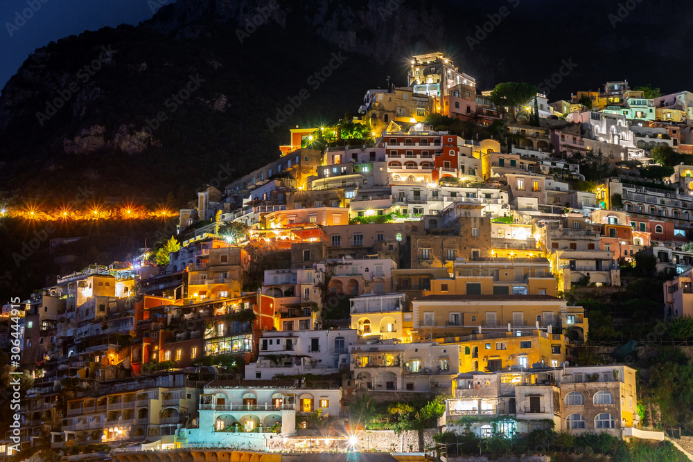 Colorful houses of Positano along Amalfi coast at night, Italy.