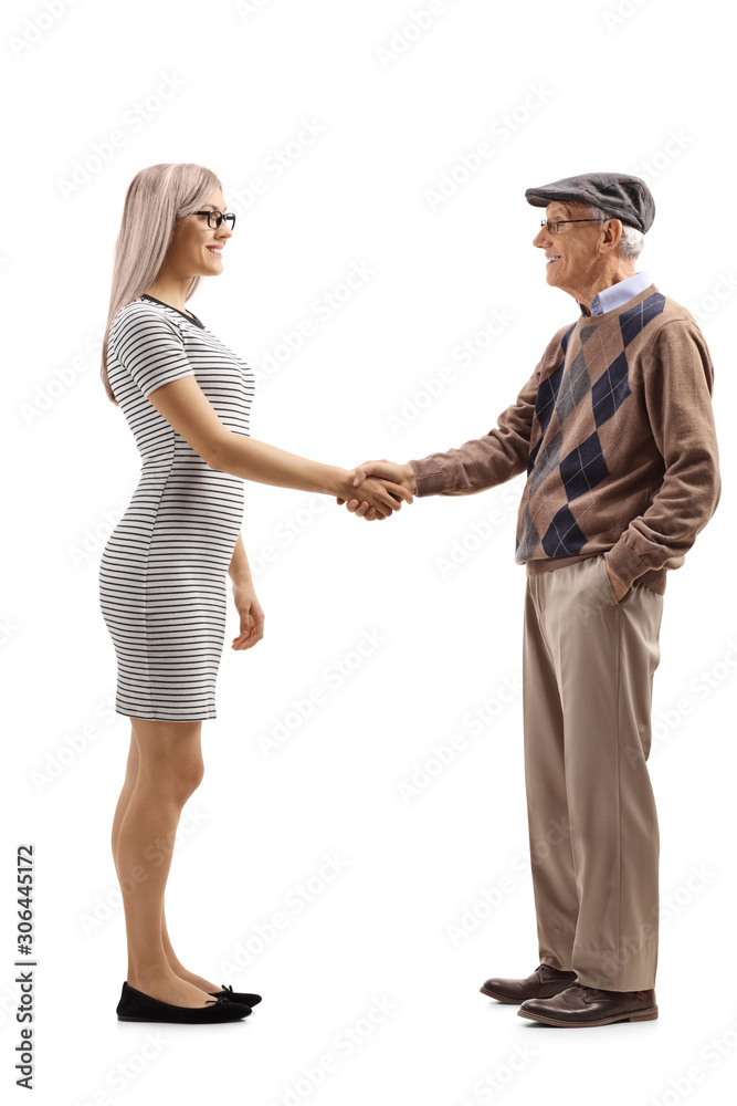 Young woman shaking hands with a senior gentleman Young woman shaking hands with a senior gentleman