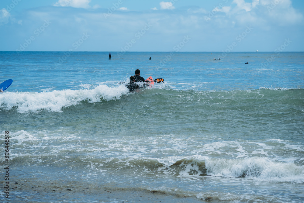 paralyzed surfer going over wave