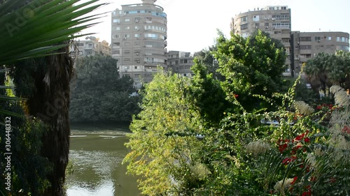 Beautiful view of river nile in Cairo Egypt showing light reflection, surrounding buildings and bouts