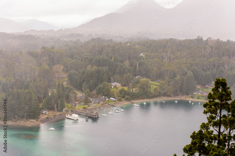 High angle view of Isthmus of Quetrihue and Brava Bay with harbor on a rainy day in Los Arrayanes National Park, Villa La Angostura, Patagonia, Argentina