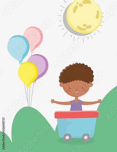 kids zone, cute little boy in wagon with balloons outdoors