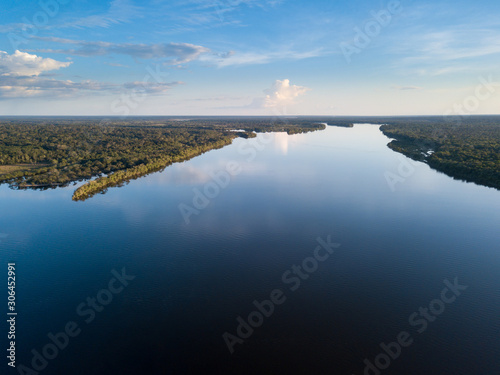 Beautiful aerial drone view of Xingu river in the Amazon rainforest on sunny summer day with blue sky. Mato Grosso, Brazil. Concept of nature, ecology, natural resources and environment. photo