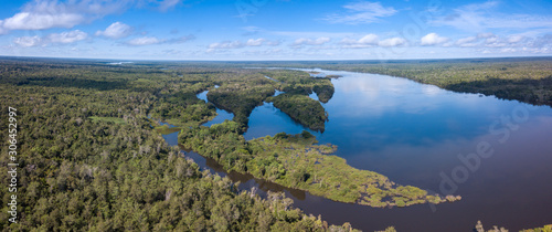 Beautiful aerial drone panoramic view of Xingu river in the Amazon rainforest on sunny summer day with blue sky. Mato Grosso, Brazil. Concept of nature, ecology, natural resources and environment. photo