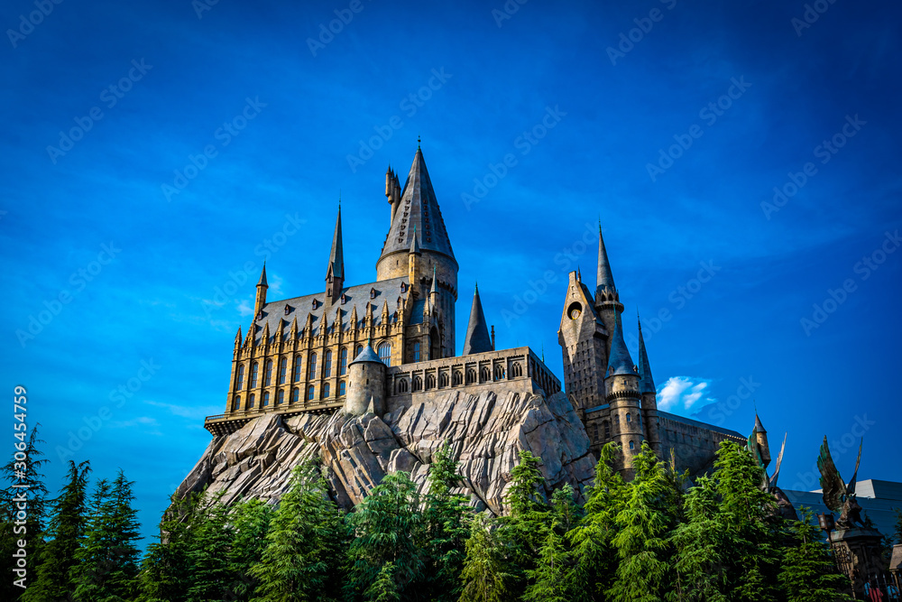 Naklejka premium OSAKA, JAPAN - AUGUST 10, 2019: Photo of Hogwarts Castle. The Wizarding World of Harry Potter in Universal Studios Japan. Universal Studios Japan is a fun and famous theme park in Osaka, Japan.