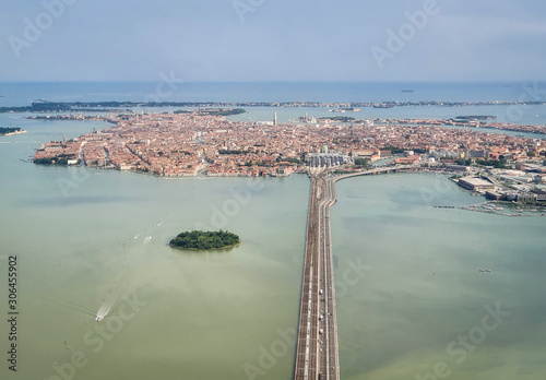 Venice, Italy - Panoramic aerial view. Top view of popular Venice on a sunny day from a window plane.