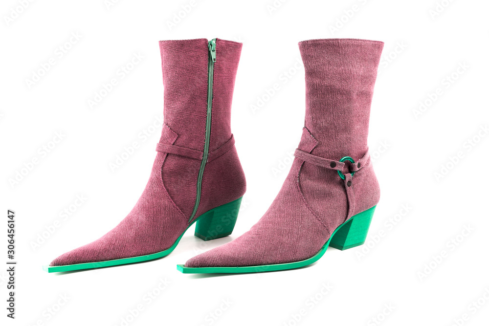 Female green and pink leather boots on white background, isolated product, top view.