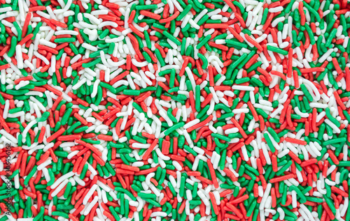 background texture-full frame close up of red, green and white Christmas candy sprinkles