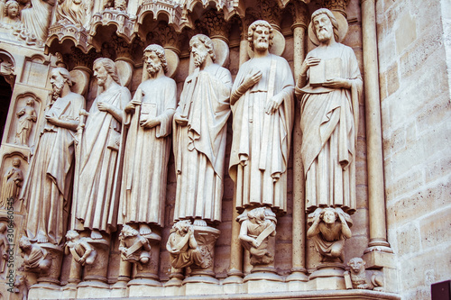 Statues of Saints, Kings and Bishops lining the entrance to the Notre Dame Cathedral in Paris, France.