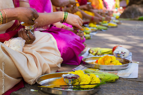 A close up of a Hindu woman's hands as she performs worship (puja)