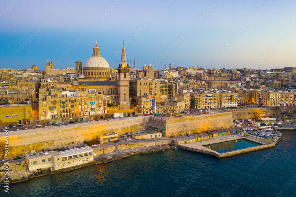 Valletta - capital of Malta. Aerial view, sunset, evening, church, blue sky 