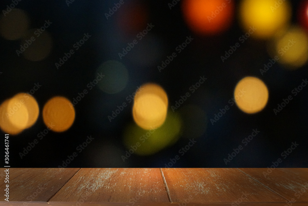 Empty dark wooden table in front of abstract blurred bokeh background of restaurant . can be used for display or montage your products.Mock up for space. Empty dark wooden table in front of abstract blurred bokeh background of restaurant . can be used for display or montage your products.Mock up for space.