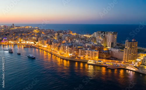 Sliema city on the evening  dusk. Aerial view. The Tigne Point complex and sea. Malta