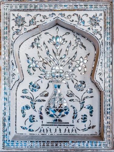 Detail of a decorative wall in the Mirror Palace at Amber Fort in Rajasthan, India,