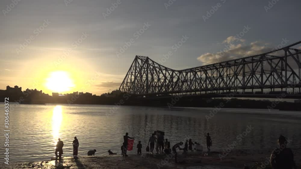 Kolkata Howrah Bridge sunset Timelapse with people having a shower