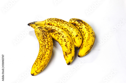 Organic bananas with freckles on fruit peels