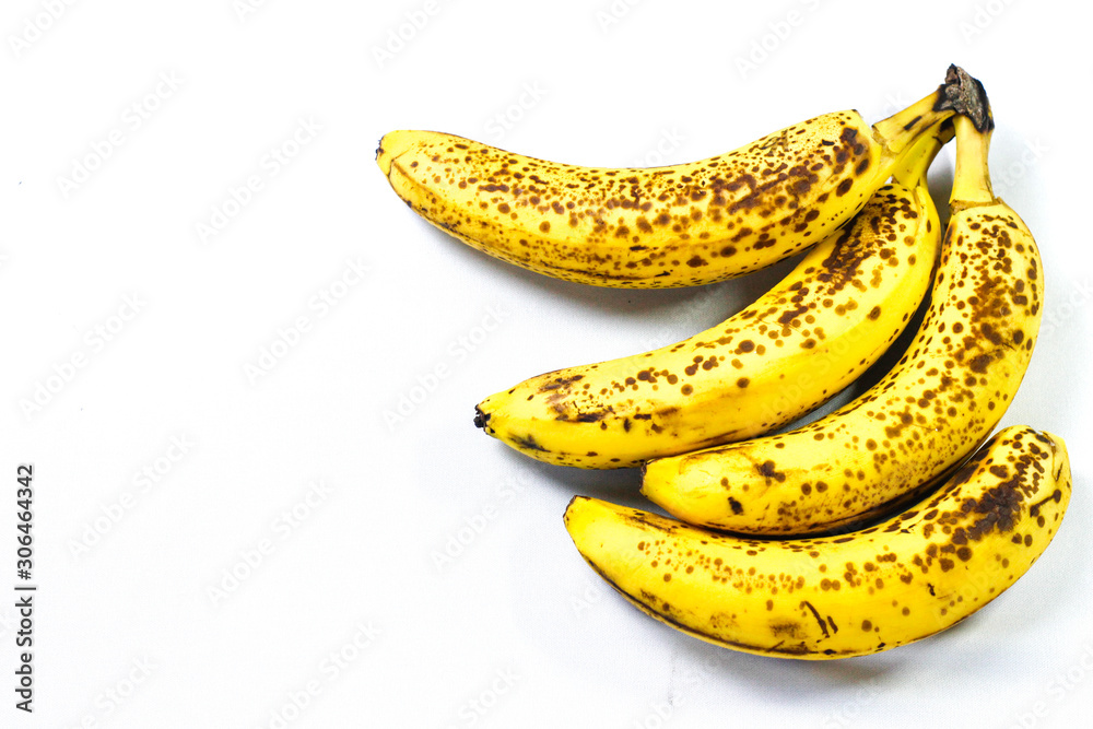 Organic bananas with freckles on fruit peels