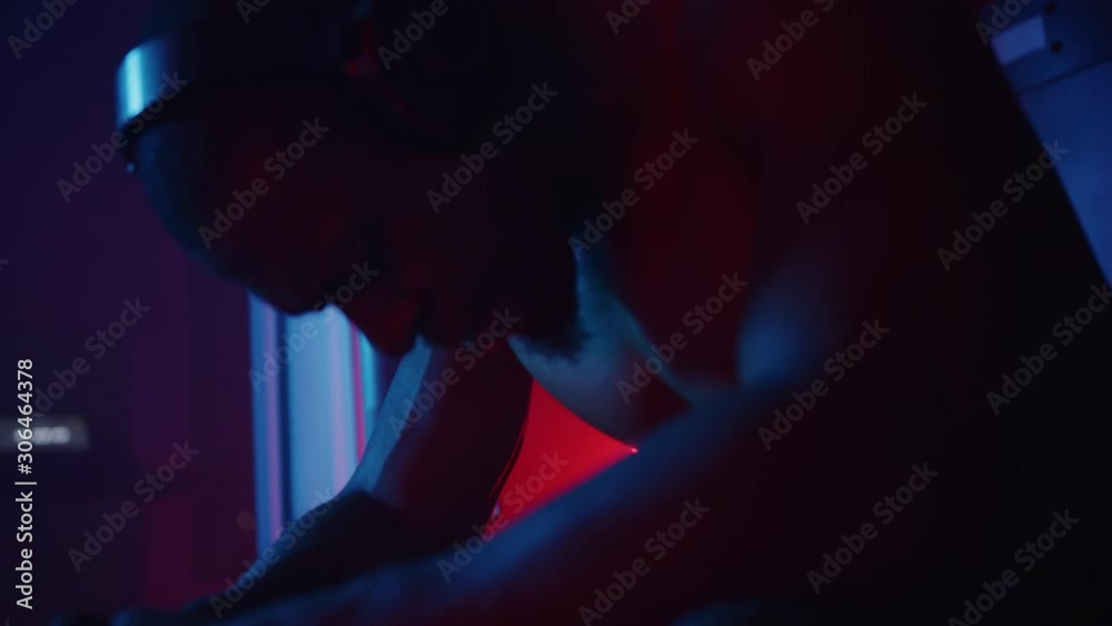 African-American athlete taking a break, intense working out, listening to music while training, dramatic lightning, shot on Red Weapon Helium African-American athlete taking a break, intense working out, listening to music while training, dramatic lightning, shot on Red Weapon Helium