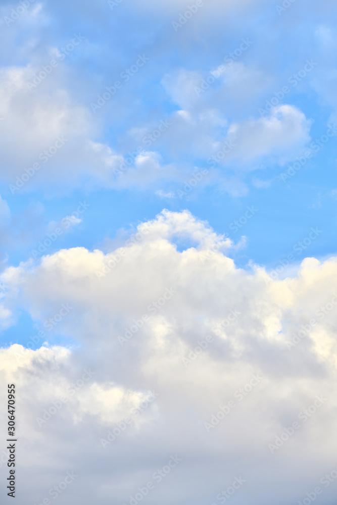 Beautiful blue sky with clouds on a bright day. Vertical photography Beautiful blue sky with clouds on a bright day. Vertical photography
