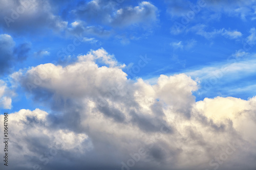 Gloomy beautiful blue sky with clouds on a bright day. Horizontal photography