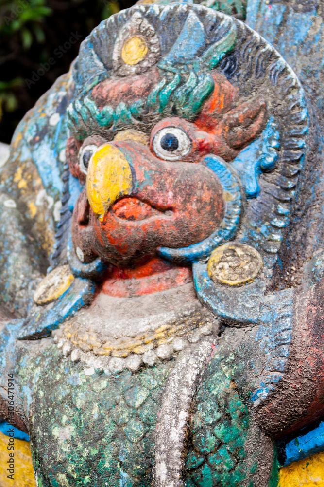 A painted statue of Garuda, the half-man, half bird carrier of the Hindu god Vishnu.