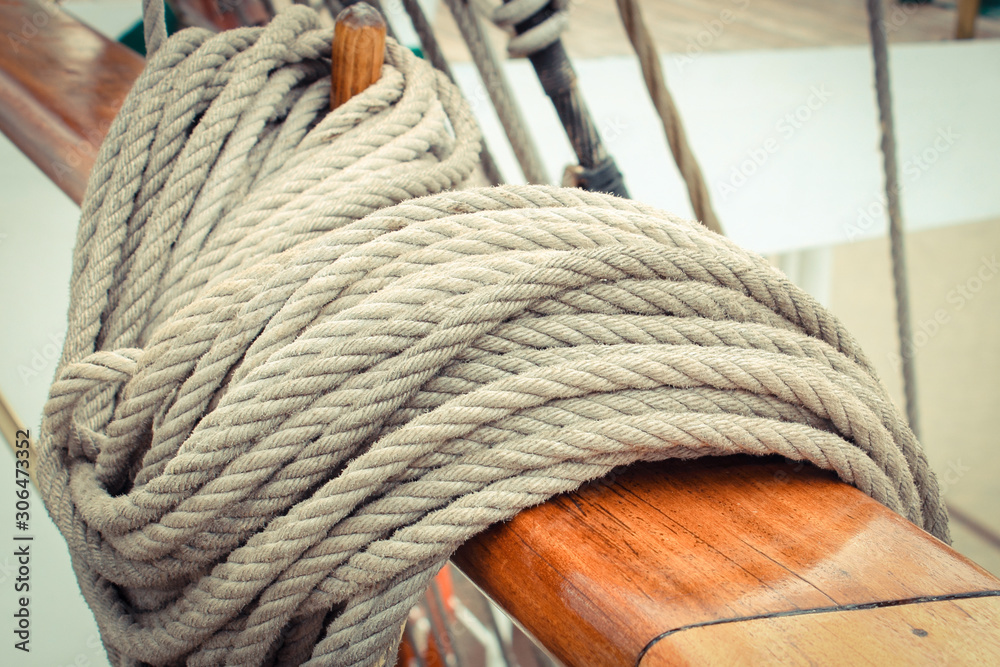 Thick ropes on sailboat. Part of yacht concept