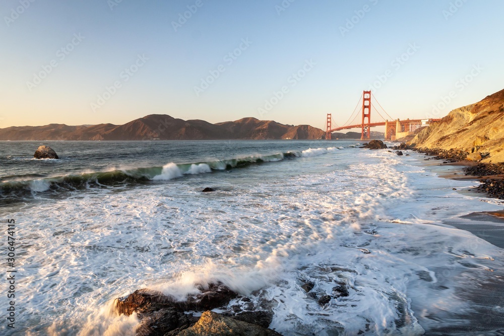 Golden Gate Bridge and Pacific ocean waves view from Marshal's beach in San Francisco California United States
