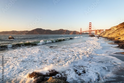 Obraz na płótnie Golden Gate Bridge and Pacific ocean waves view from Marshal's beach in San Francisco California United States w salonie