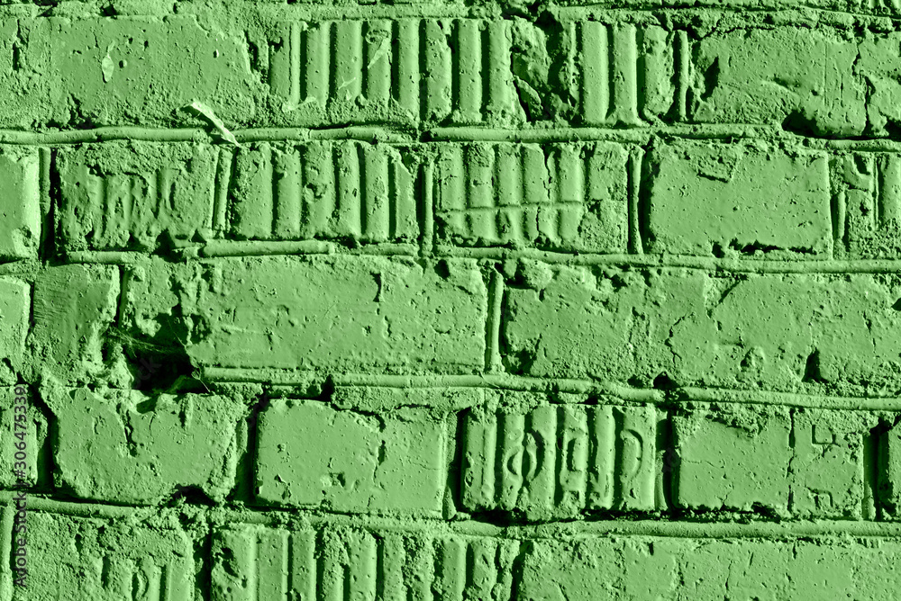 Painted brick wall close up. Abstract background green color toned Painted brick wall close up. Abstract background green color toned