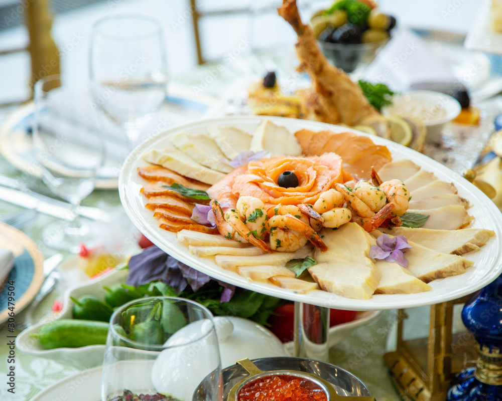 seafood platter with fried shrimps, smoked salmon and other fish slices seafood platter with fried shrimps, smoked salmon and other fish slices
