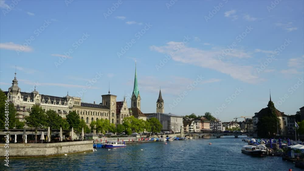 Timelapse Zurich city center with famous Fraumunster and Grossmunster Churches and river Limmat at Zurich Lake in Switzerland Timelapse Zurich city center with famous Fraumunster and Grossmunster Churches and river Limmat at Zurich Lake in Switzerland